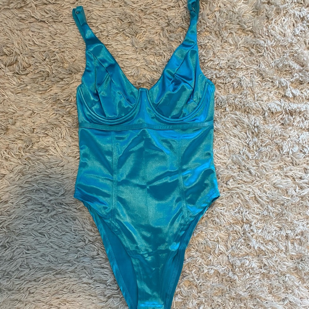 A cute light shiny blue bodysuit, small